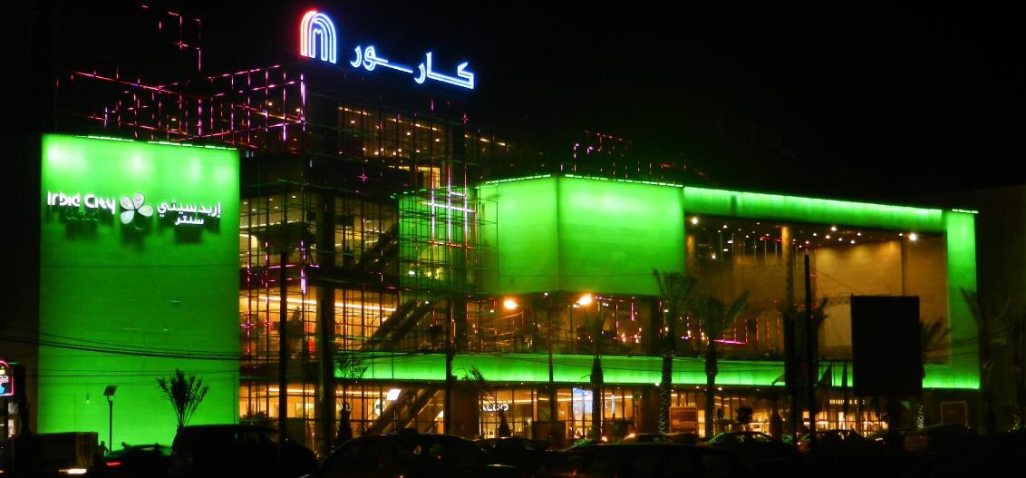 Irbid City Centre mall illuminated facade at night